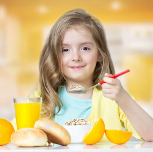 Child in creche eating nutritious food