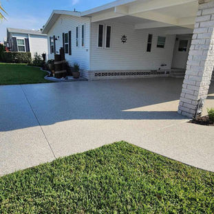 Durable epoxy flooring on a driveway, resistant to cracks, weather, and heavy traffic.
