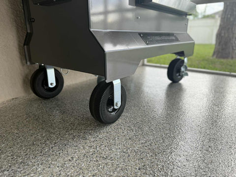 Close up Polyaspartic Patio in Stonehenge with a grill on wheels.