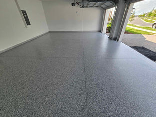 Smokey Blue Color Chip Blend on Garage Floor. Mixture of grey and blues. The topcoat reflect the sun a bit as well