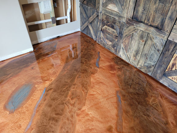 High-gloss metallic epoxy flooring offering superior shine and easy maintenance.
