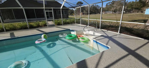 Stonehenge Pool Deck Polyaspartic Epoxy Coating Hybrid Solution with floaties