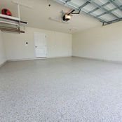 Polyaspartic Garage Flooring in Central Florida wide angle bright warm tone flakes