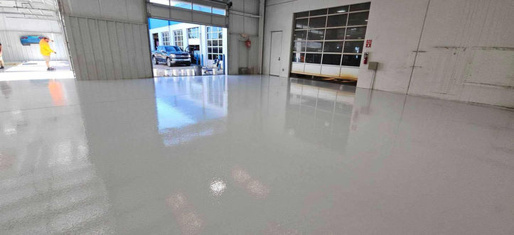 Enhance safety and aesthetics in your shop with Tru-Grit's custom industrial flooring. Designed to withstand heavy use while looking polished.