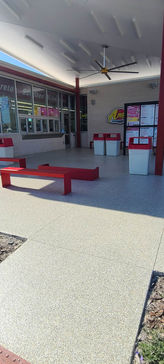 The commercial polyaspartic coating offers superior durability, ideal for heavy foot traffic in Andy’s Frozen Custard.