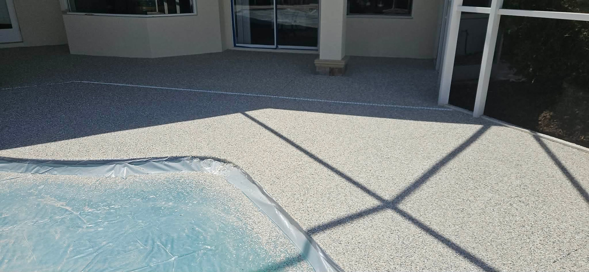 Barnacle UV Polymer Flake Broadcast for Polyaspartic Pool Deck Resurfacing Franco Project in On Top Of The World Florida 10