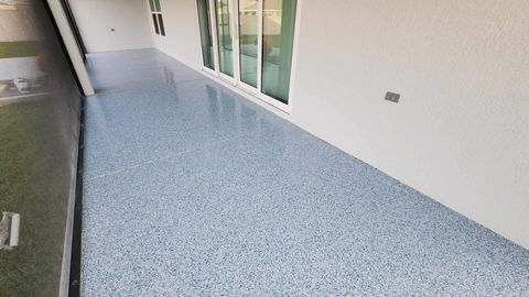 Sea Glass Flake Blend Patio Setting: Transform your outdoor living space with our Sea Glass flake blend, offering a refreshing blend of blue and green flakes that bring a coastal-inspired aesthetic to your patio, ideal for enjoying sunny days and evenings outdoors.