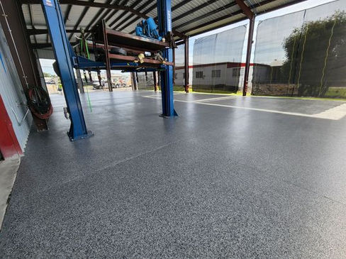 Lakeland Auto Service INC benefits from the high-performance protection of polyaspartic epoxy floors in a demanding commercial environment.