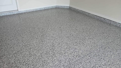 Domino Flake Blend Garage Transformation: Elevate your garage with our Domino flake blend, showcasing a bold blend of black, white, and gray tones that provide a sleek and contemporary look, ensuring a visually appealing and long-lasting surface.