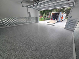 silver bells garage epoxy floor with our truck and trailer in background