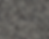 Gray and black speckled pattern covering the entire image; resembles a rough, textured surface. No visible text or distinct subjects.
