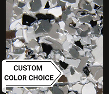 Textured flake close-up of Chinchilla, showing a sophisticated blend of taupe, brown, and pesto-gray tones for natural, upscale flooring.