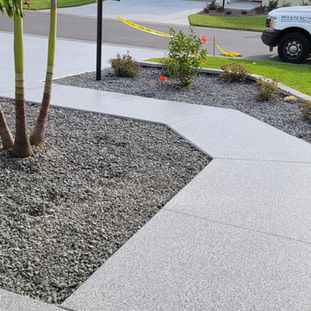 High-gloss epoxy coating on a driveway, providing superior shine and easy maintenance.