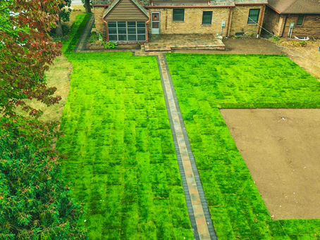 Aerial view of St. Paul backyard with large stepping-stone walkway across lawn leading to a small shed.