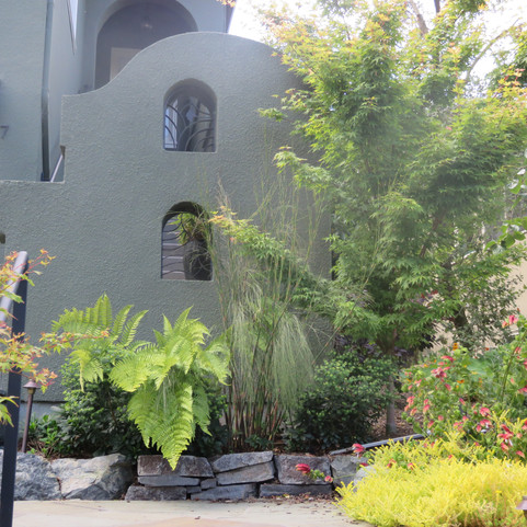newly designed entry wall gives some privacy to the front door while complementing the building's architectural features