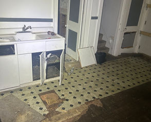 Interior kitchen and hallway condition at 7714 Holmes St Detroit