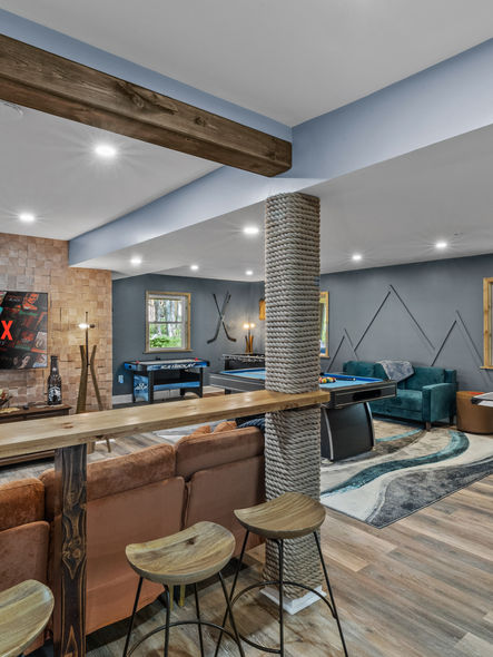 Modern game room with Netflix, ping pong, pool table, and lounge seating at Midnight Cedar Haus