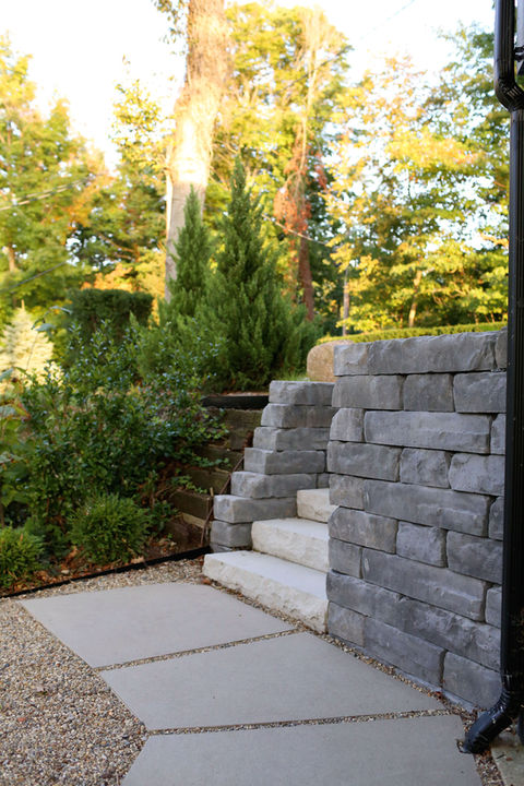 a stone wall with stairs leading up to it