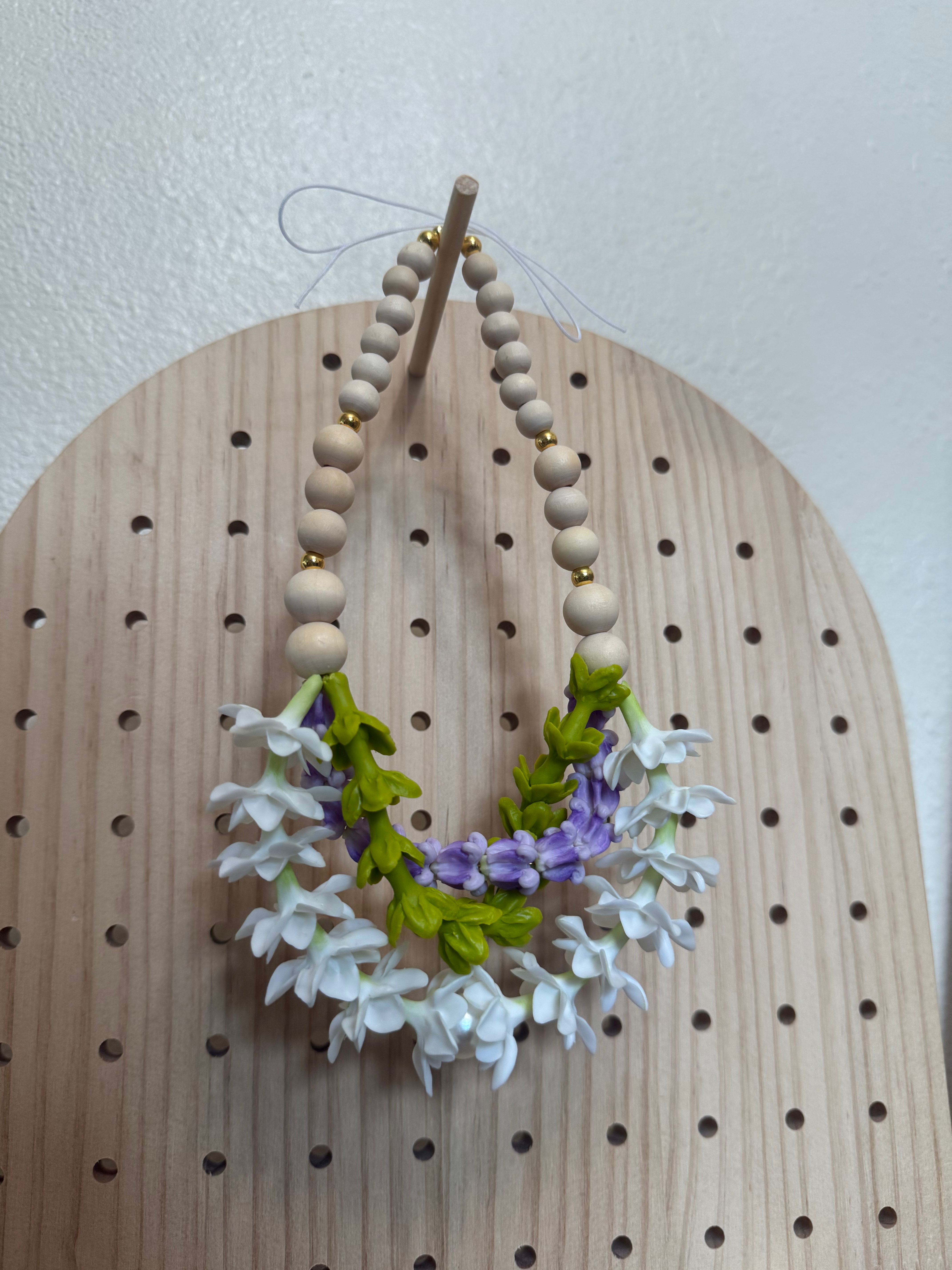 Twisted Double Pikake Blossoms, Pakalana, and Purple Crown with Wood Beads 