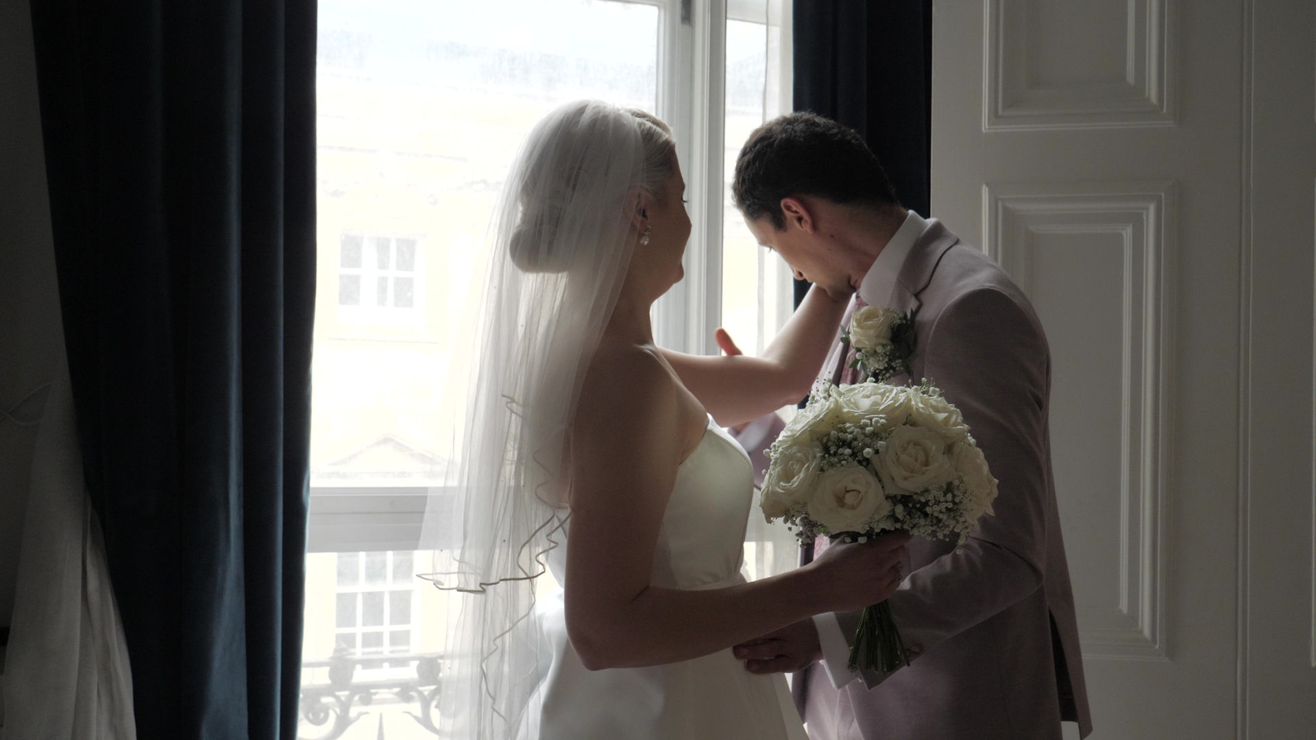 Candid moment of bride and groom's first look in wedding teaser film