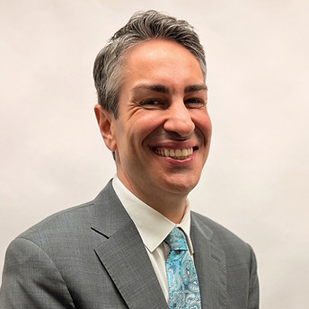 Man in suit smiling