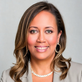 Smiling woman wearing a blazer and pearl necklace