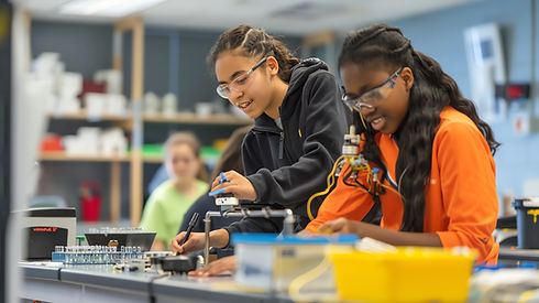 two-young-female-students-wearing-safety-glasses-are-working-science-experiment-classroom.