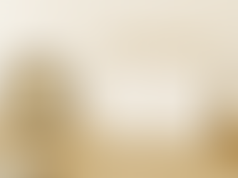 Minimalist beige and gold workspace with laptop, documents, and coffee cup — representing real estate transaction coordination.