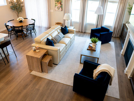 Mt. Juliet, TN modern farmhouse living and dining room interior design with neutral palette, pops of navy blue, and open floor plan.