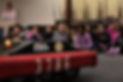 Children sitting in front of robot