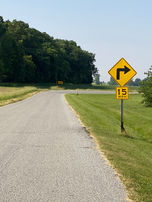 Right curve ahead, 15 mph: Ross TWP road