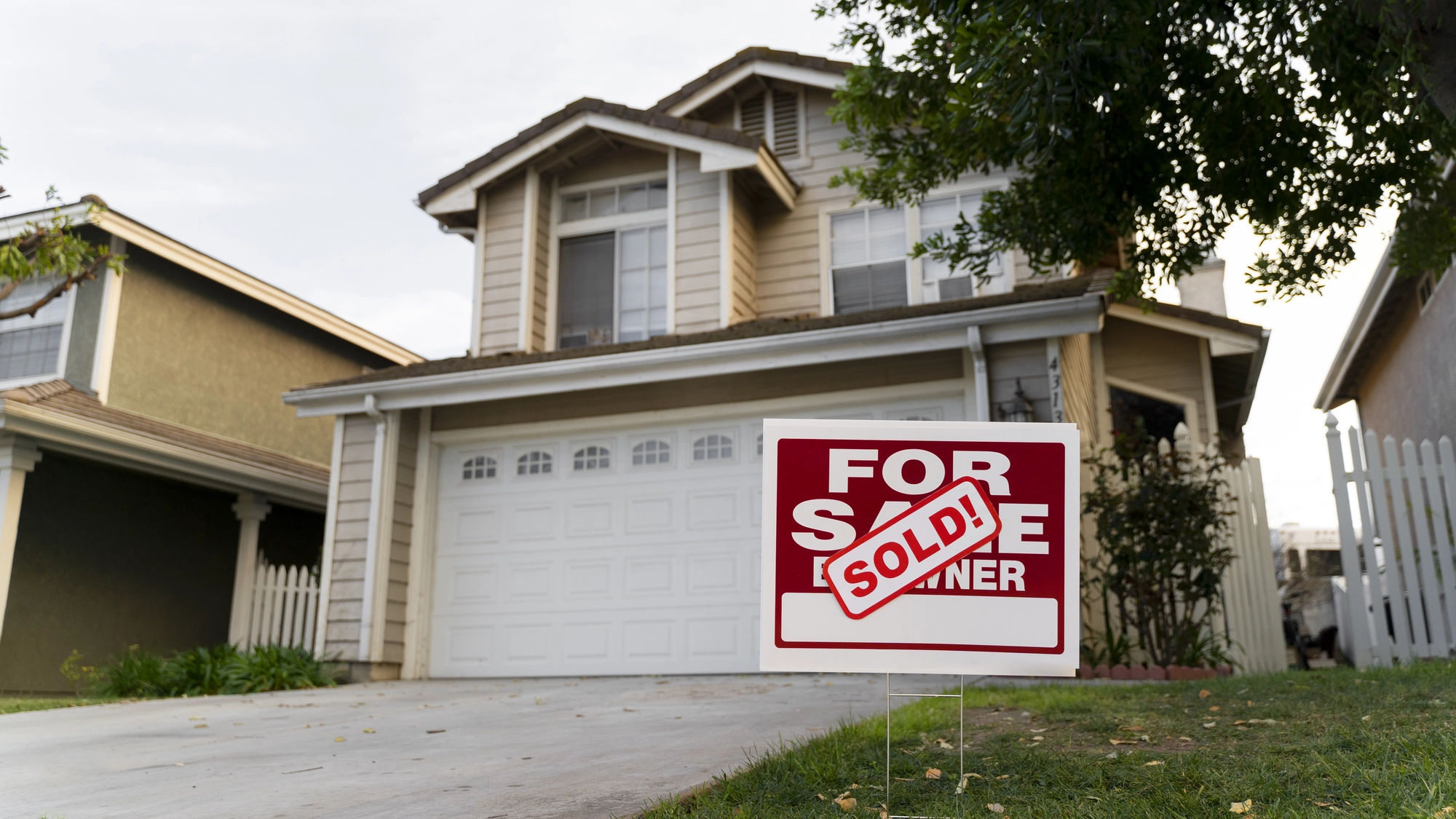 house-with-sold-yard-sign.webp