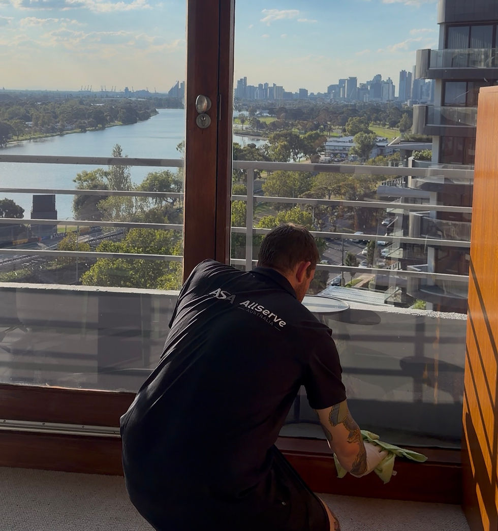 Cleaner working at height during end of lease cleaning in Melbourne property