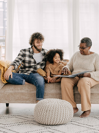 Family sitting together on couch