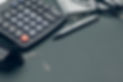 business-still-life-with-calculator-on-table-in-of-2023-11-27-04-52-39-utc.jpg