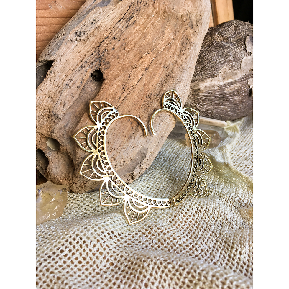 Thumbnail: Pair of brass ear cuffs arranged in a heart-like shown froma different angle
