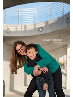 Mother hugging her young son during a fun family portrait session in St. Petersburg, Florida