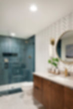 Modern bathroom project with blue shower and herringbone wall