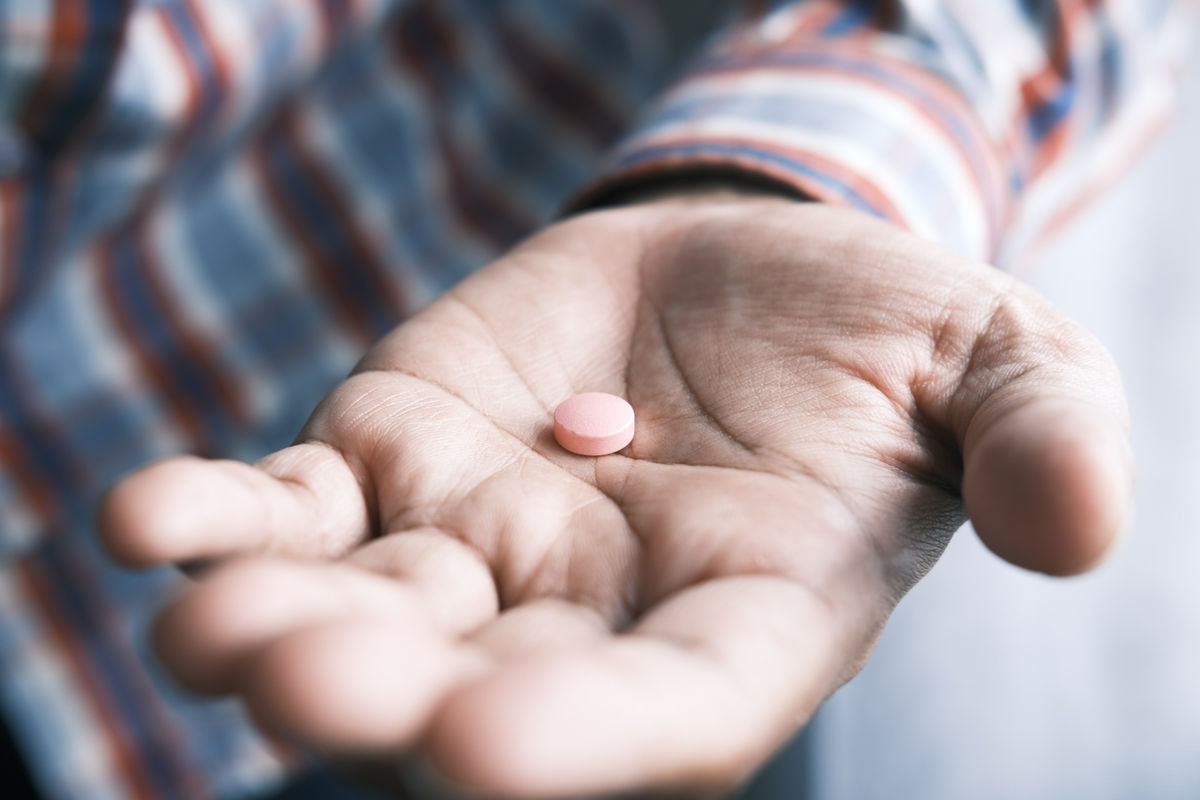 pill in man's hand