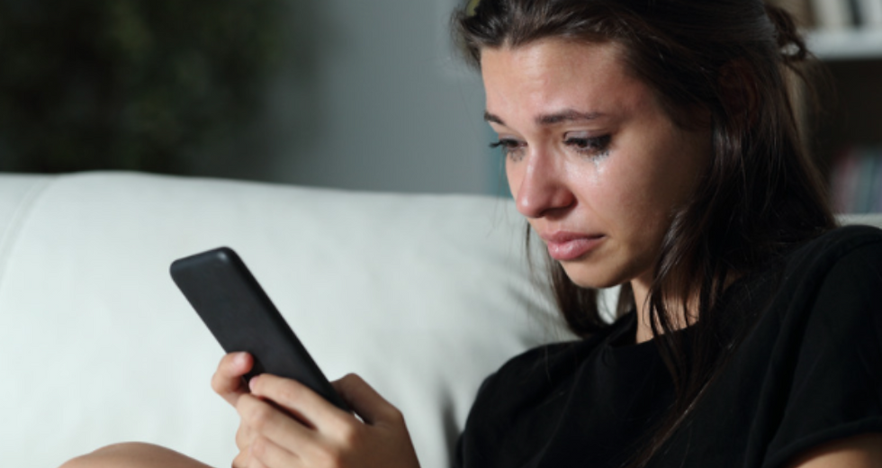 Girl crying from being bullied by AI
