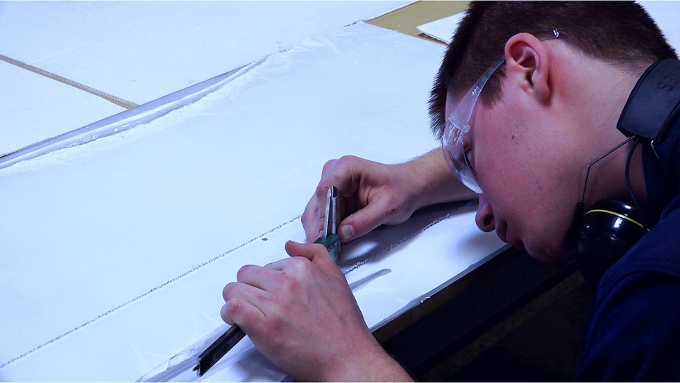 A machinist taking measurements.