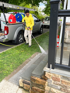 Pressure washing front porch.
