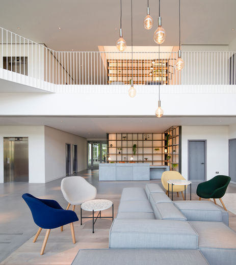 interior space at birchwood building showcasing the minimal approach to design, with the lines from the brand symbol reflected in the staircase banister.
