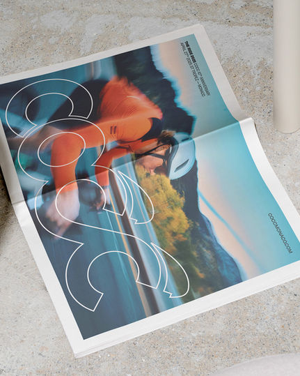 COCC newspaper ad for an upcoming cycling event, combining event details, location, brand logo, and art direction into one design.