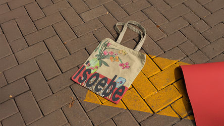 Tote bag printed with the Isoebe Archive logo and the artist’s collage, making the bag a piece of art.