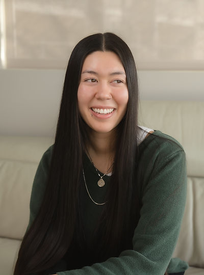 Young woman smiling in airy room