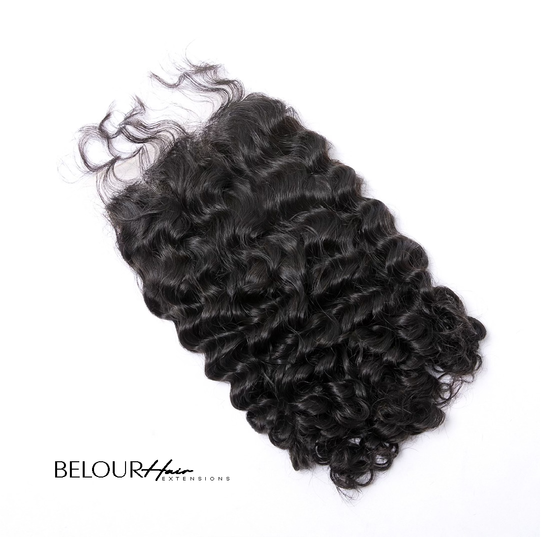 Burmese curly lace closure with tightly coiled, voluminous curls and a natural luster. The lace spans ear to ear, offering full front hairline coverage with a realistic scalp effect. Hair is rich in texture with medium-to-high density and a natural black to dark brown