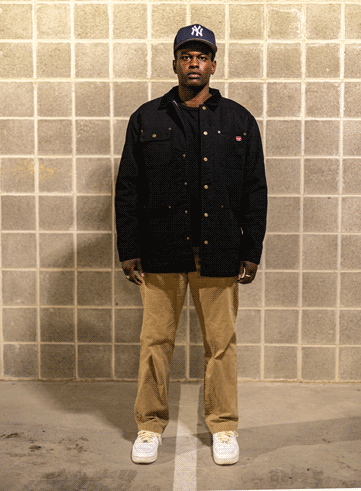 K Sama modeling a SPAULV 'Gibberish Jones' work jacket