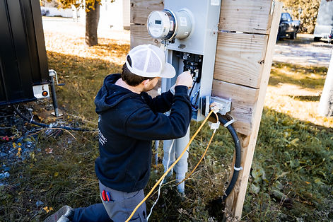 Nick Hood working on an electrical panel