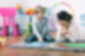 Private teacher and small boy learning by play at home.jpg
